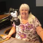Woman presenting in radio studio.